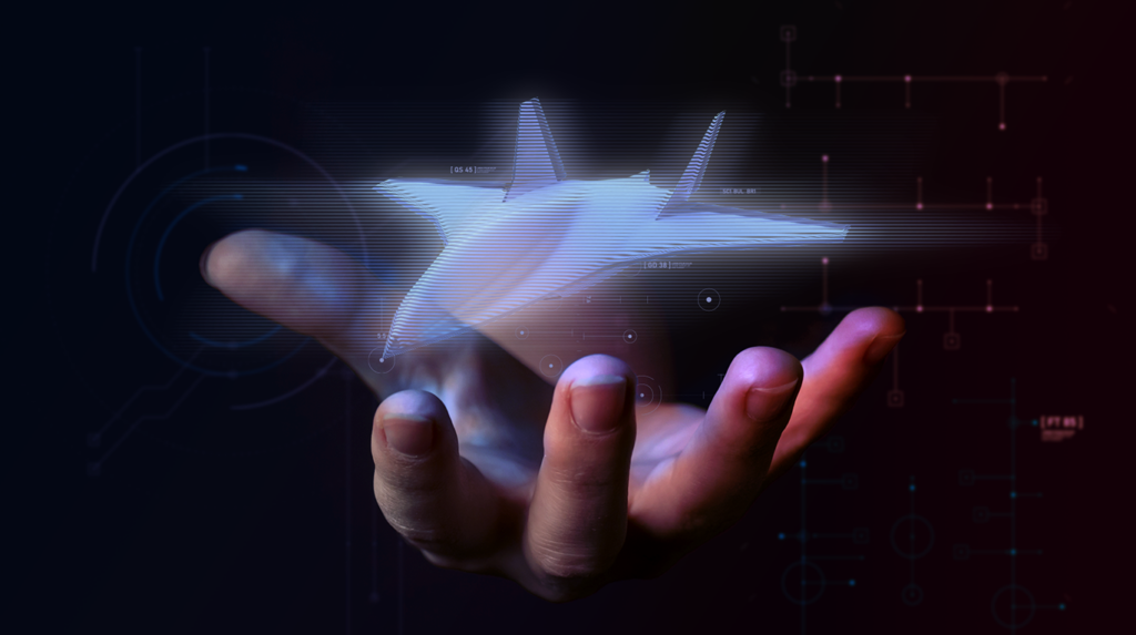 Hand displaying holographic aircraft model with digital interface graphics in the background.
