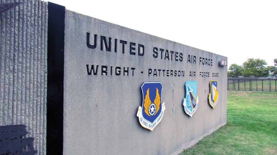 Wright-Patterson Air Force Base entrance sign with military emblems.