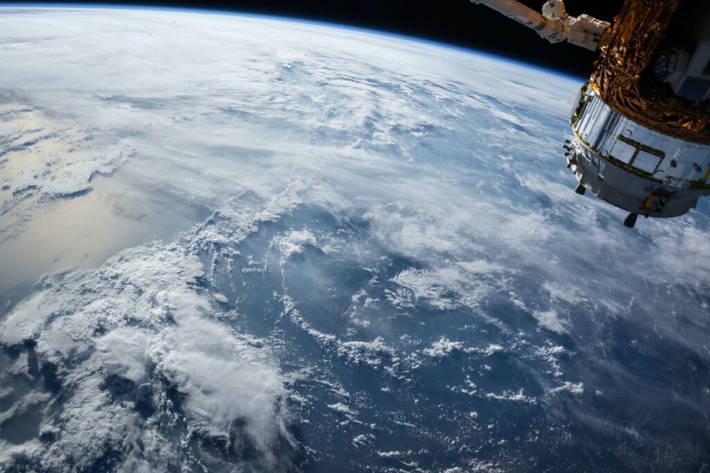 Earth’s atmosphere and cloud formations viewed from space orbit.
