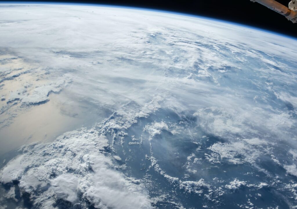 Earth’s atmosphere and cloud formations viewed from space orbit.