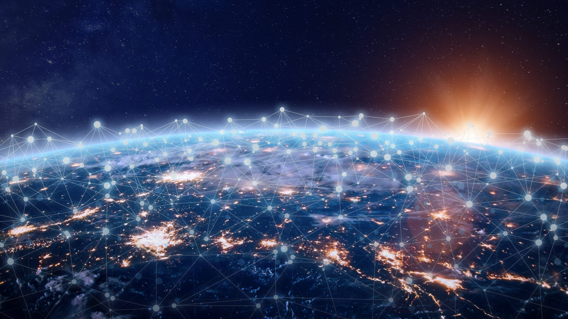 Global digital communications network visualization above Earth at sunrise.